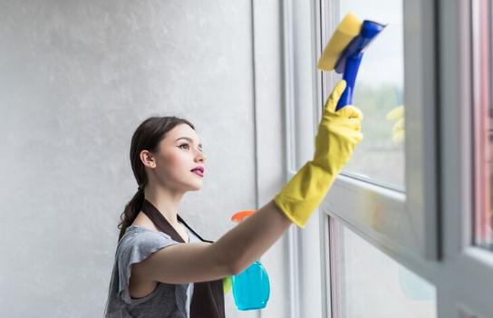 Neon Clean technician removing buildup from window tracks and frames