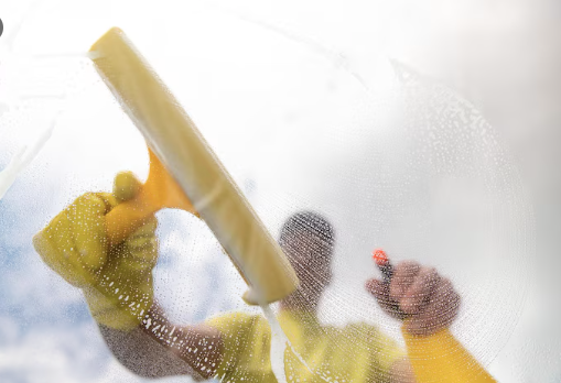 Routine seasonal window cleaning service in progress by Neon Clean team